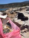 The beach around us where we anchored was littered with rubbish. We gave the locals a hand to clean it up.